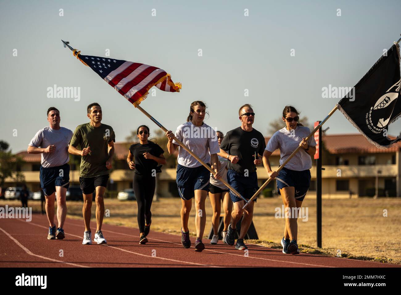 U.S. Airmen honor the legacy of Prisoners of War and Missing in Action service members from various conflicts during the annual 24-hour POW/MIA Remembrance Run at Travis Air Force Base, California, Sept. 15, 2022. Service members, civilians and family members kept the American flag and POW/MIA flag in constant motion for a 24-hour period. According to the Defense POW/MIA Accounting Agency, more than 82,000 Americans remain missing from World War II, the Korean War, the Vietnam War, the Cold War, the Gulf Wars and other conflicts. The names of unaccounted service members were recited during the Stock Photo