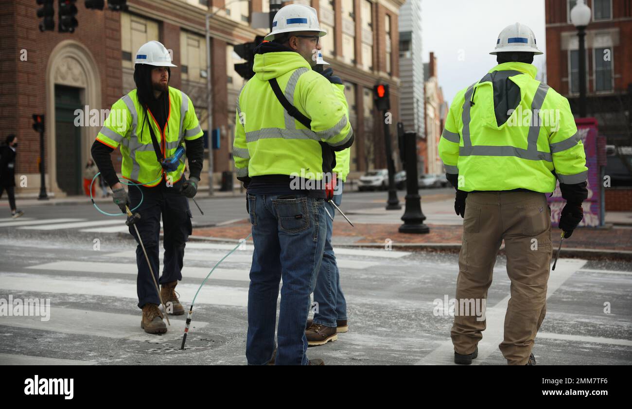 Construction Workers working at construction site yellow jacket helmet