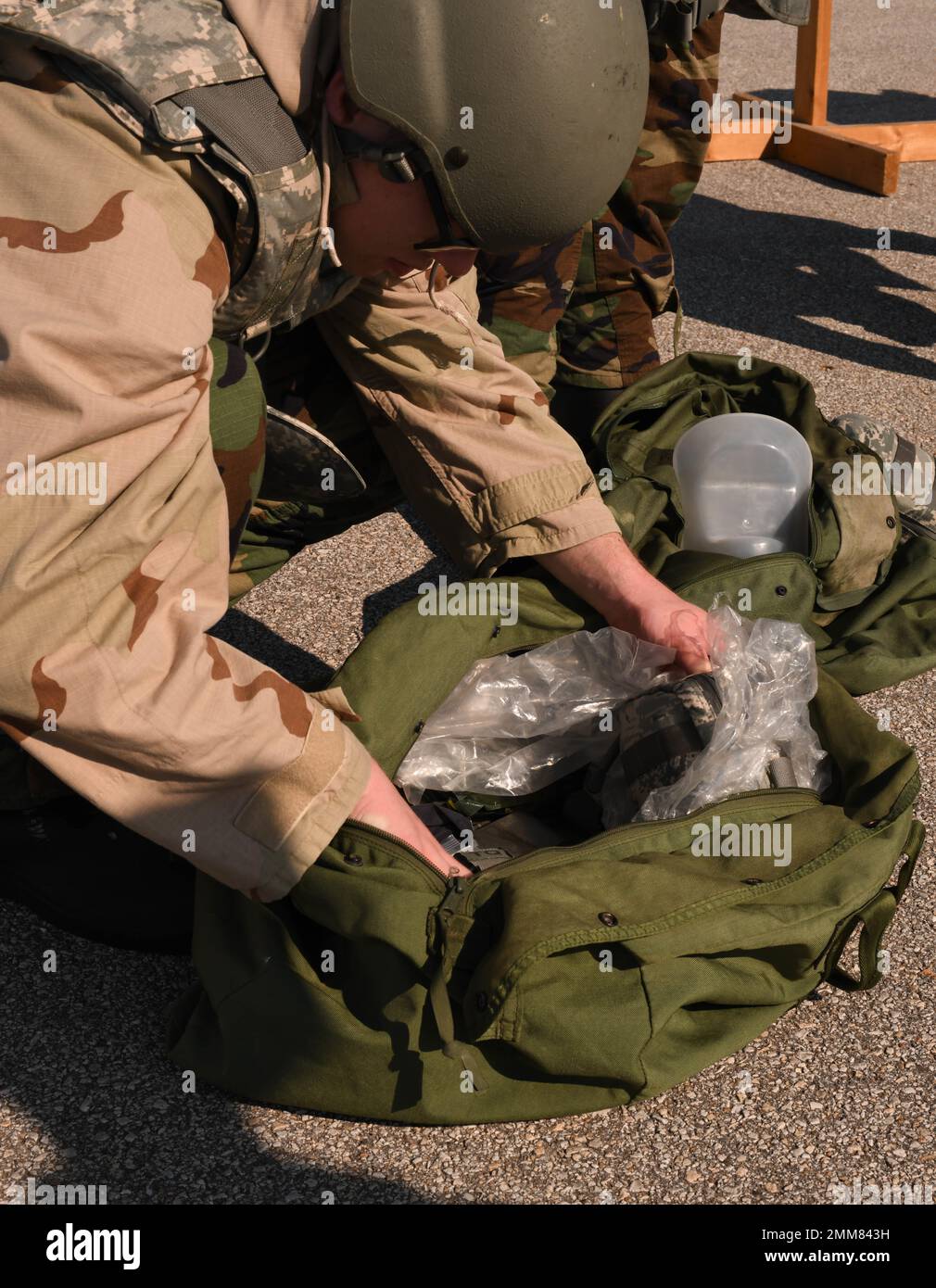 U.S. Air Force Airmen don MOPP gear during a CBRN exercise at Whiteman Air Force Base, Missouri, September, 15, 2022. MOPP gear is protective equipment worn in CBRN-contaminated environments meant to protect an individual from CBRN agents. Utilizing MOPP gear ensures Airmen are ready to respond and defend its personnel and assets. Stock Photo