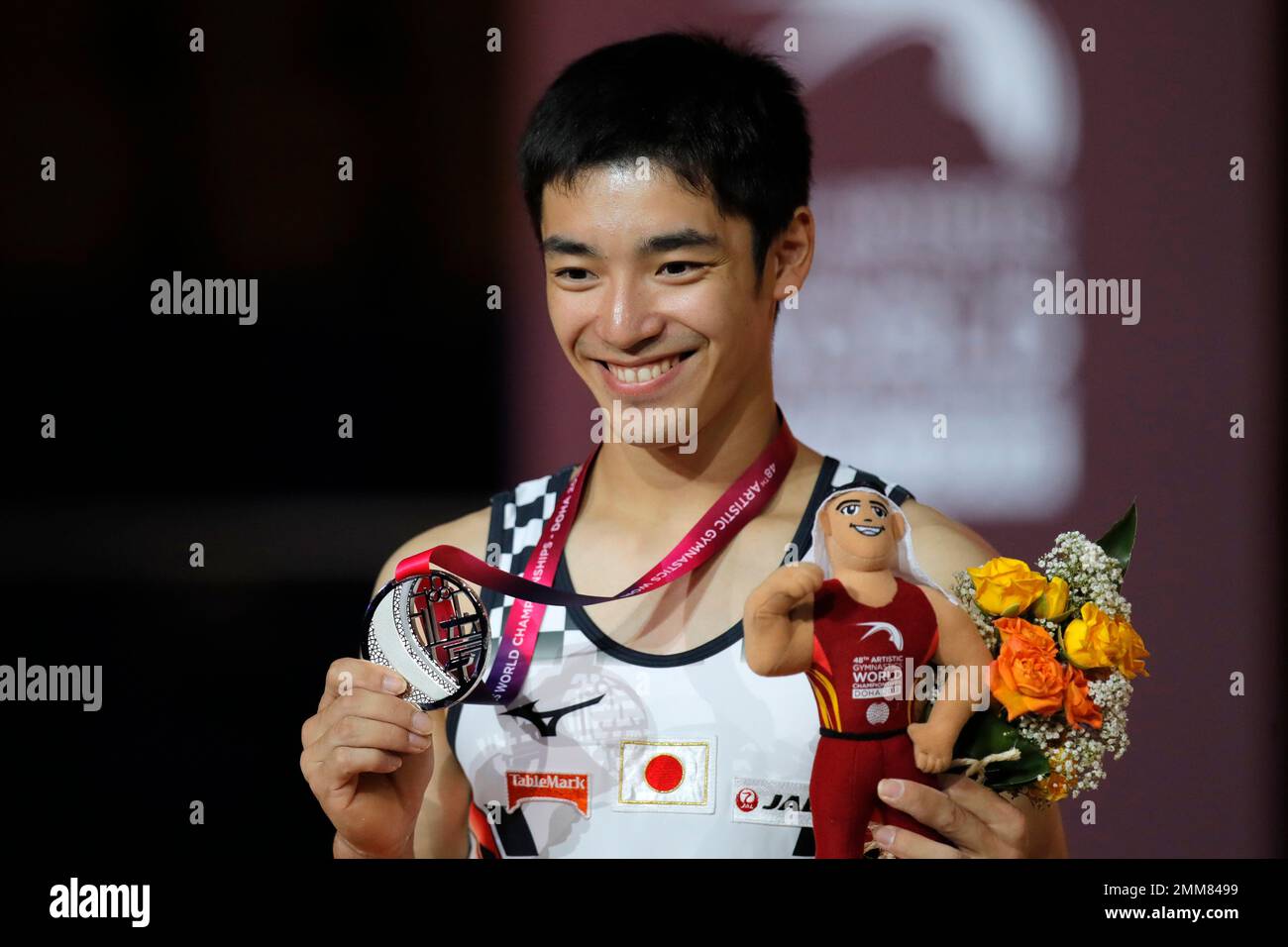Japan's Kenzo Shirai shows his silver medal after the men's floor final
