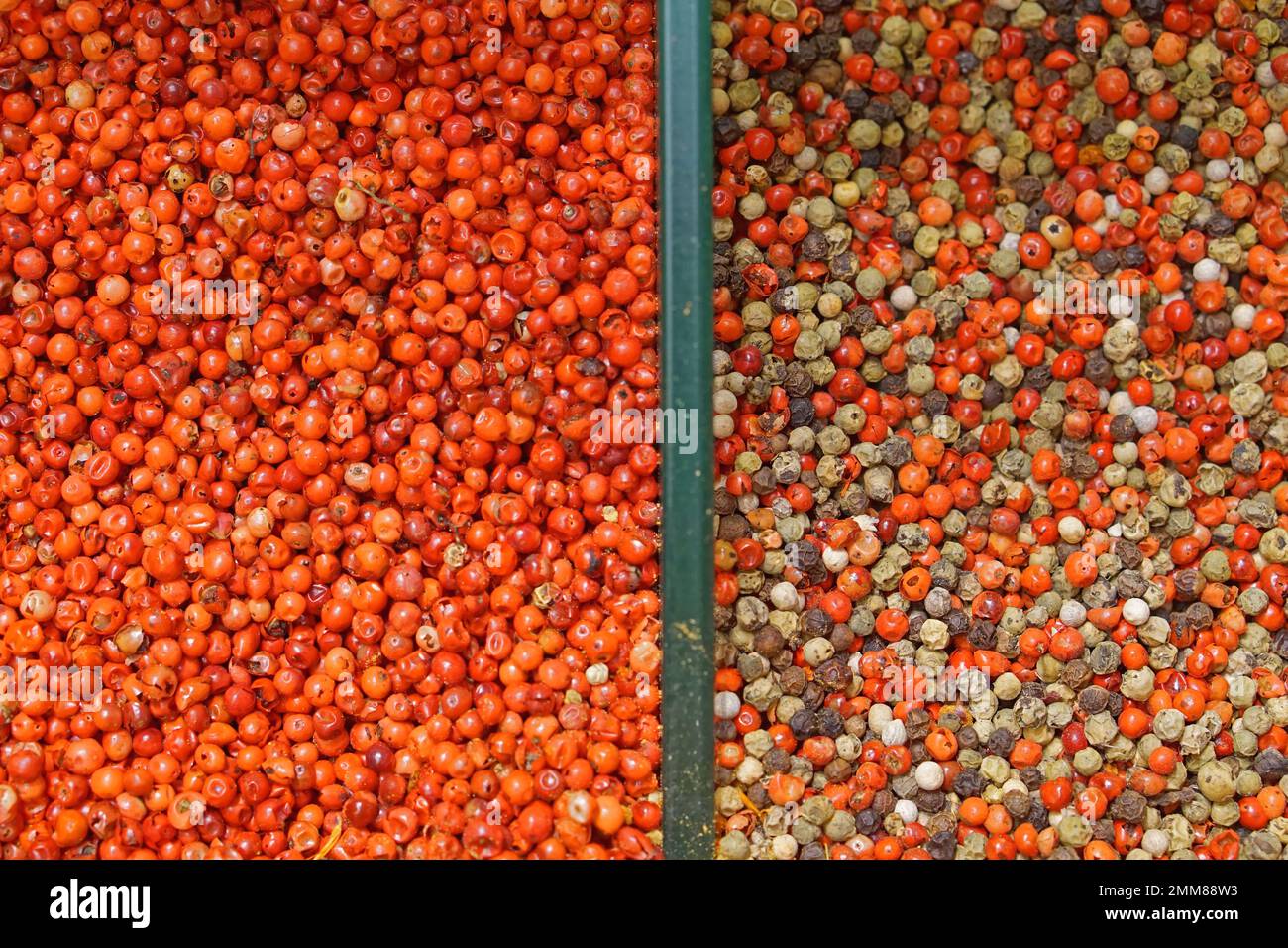 Red peppercorns mixed pepper spices in bulk market Stock Photo Alamy