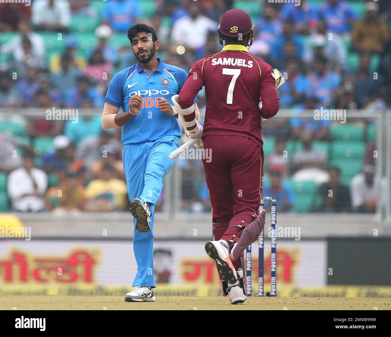 Indias Jasprit Bumrah, left, reacts after bowling a delivery to West Indies Marlon Samuels, right, during the fifth and last one-day international cricket match between India and West Indies in Thiruvananthapuram, India,