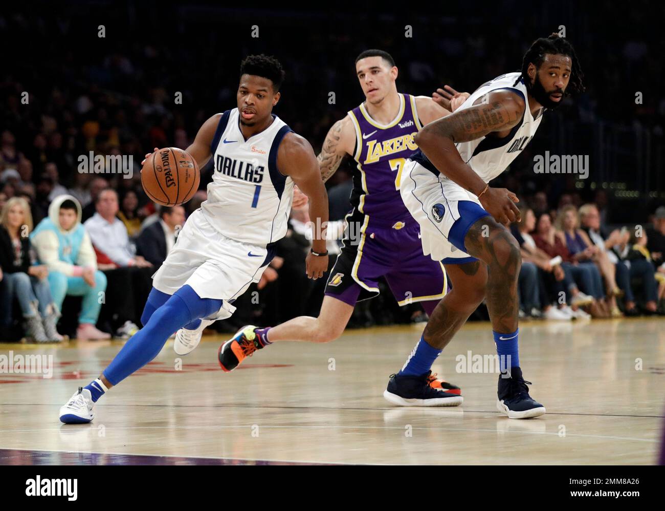 Dallas Mavericks Dennis Smith Jr. 1 dribbles past Los Angeles Lakers Lonzo Ball center on a screen from DeAndre Jordan right during the first half of an NBA basketball game Wednesday Oct