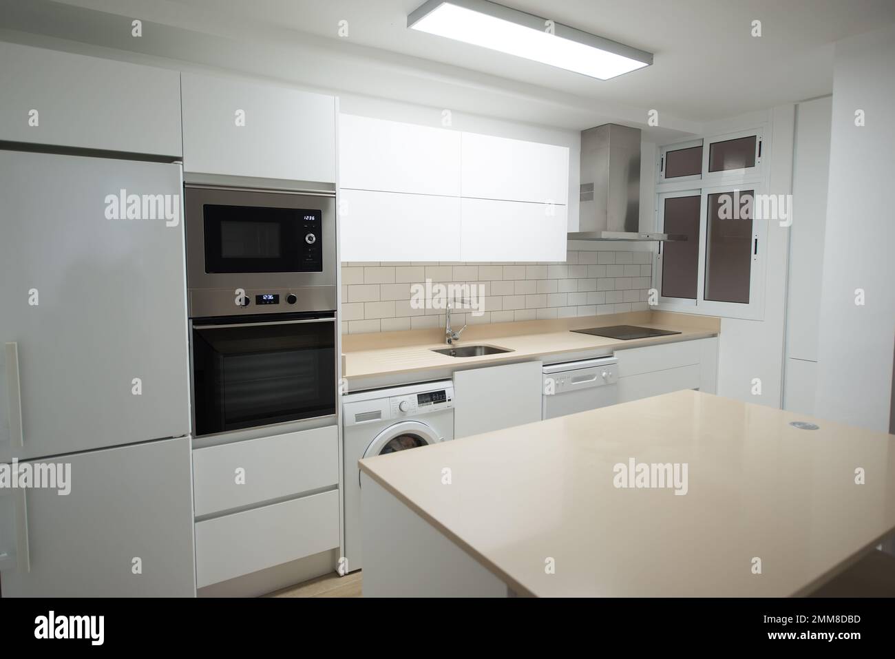 Modern electric cooking appliances and built in cabinets inside kitchen of  home Stock Photo - Alamy