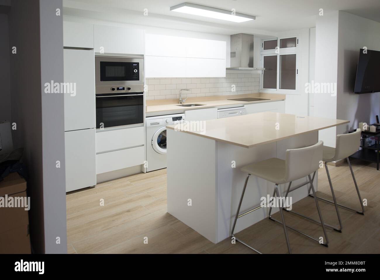 Modern electric cooking appliances and built in cabinets inside kitchen of  home Stock Photo - Alamy