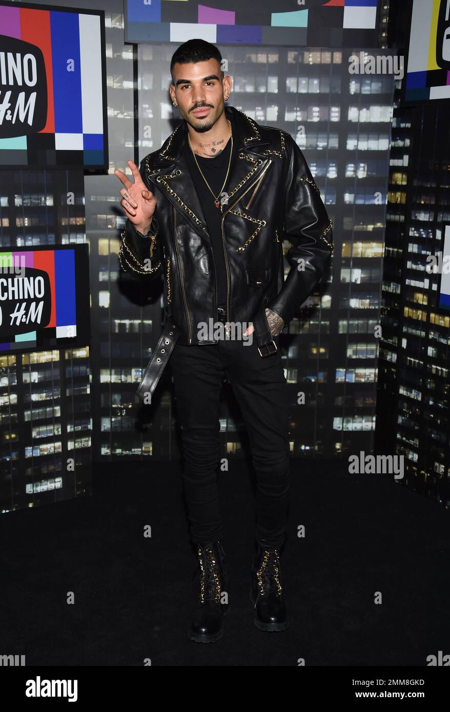 Model Miles Richie attends the Moschino x H&M fashion show at Pier 36