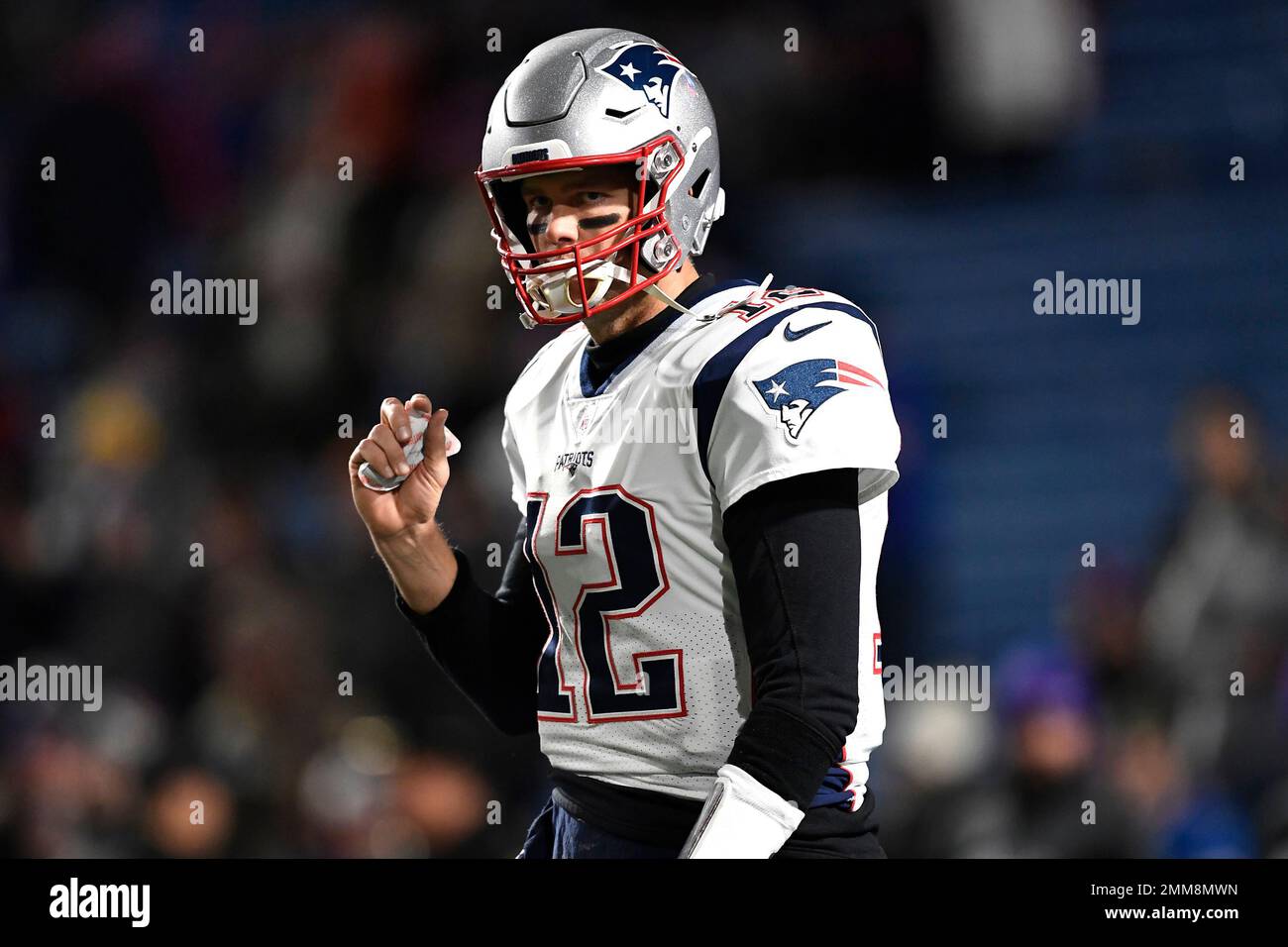 New England Patriots quarterback Tom Brady holds a hand warmer prior to an  NFL football game against the Buffalo Bills, Monday, Oct. 29, 2018, in  Orchard Park, N.Y. (AP Photo/Adrian Kraus Stock