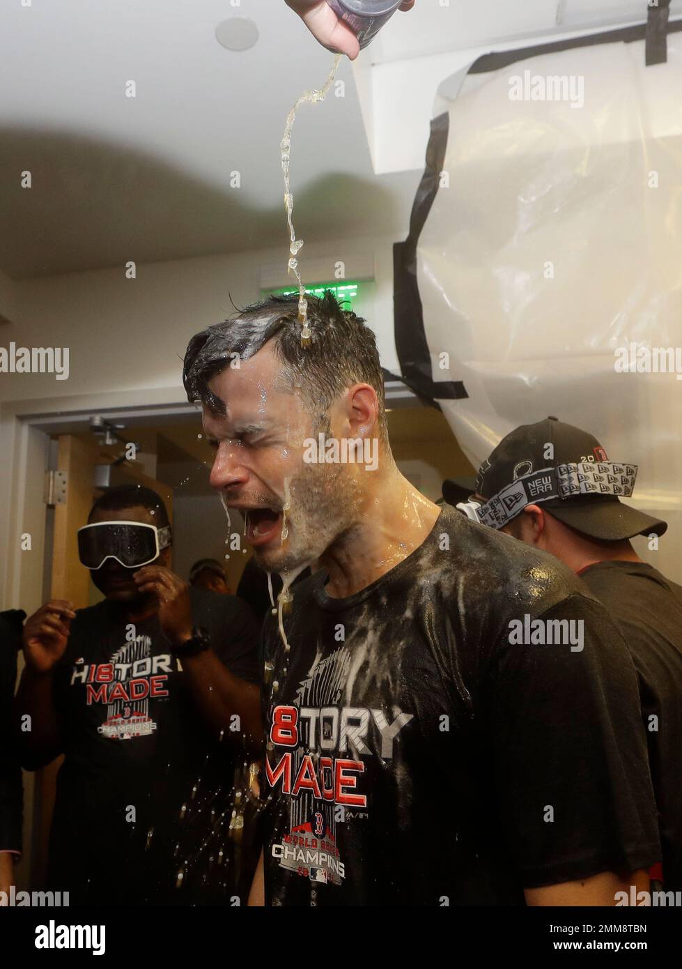 CORRECTS TO THE BOSTON RED SOX JOE KELLY FROM THE BOSTON RED SOX CHRIS SALE  - The Boston Red Sox Joe Kelly celebrates in the clubhouse after Game 5 of  baseball's World