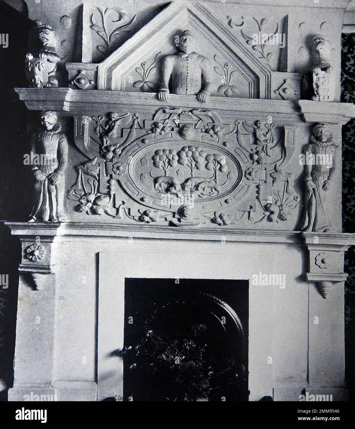 British pubs inns & taverns - A circa 1940 old photograph of a moulded plaster fireplace at the Luttrell Arms at Dunster., Somerset. Stock Photo