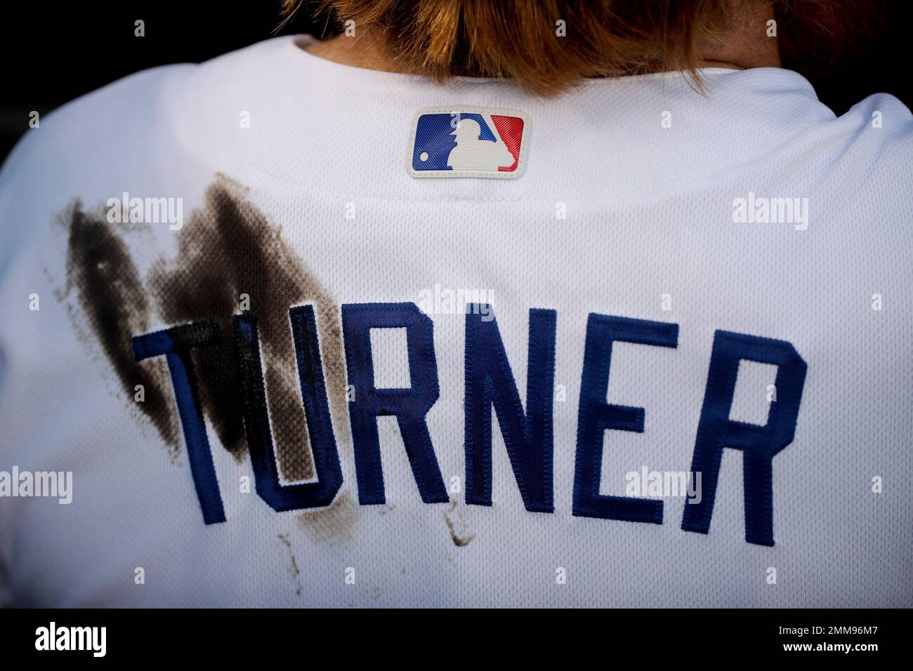 Pine tar stains the back of Los Angeles Dodgers third baseman Justin Turners'  jersey during the second inning in Game 4 of the World Series baseball game  against the Boston Red Sox