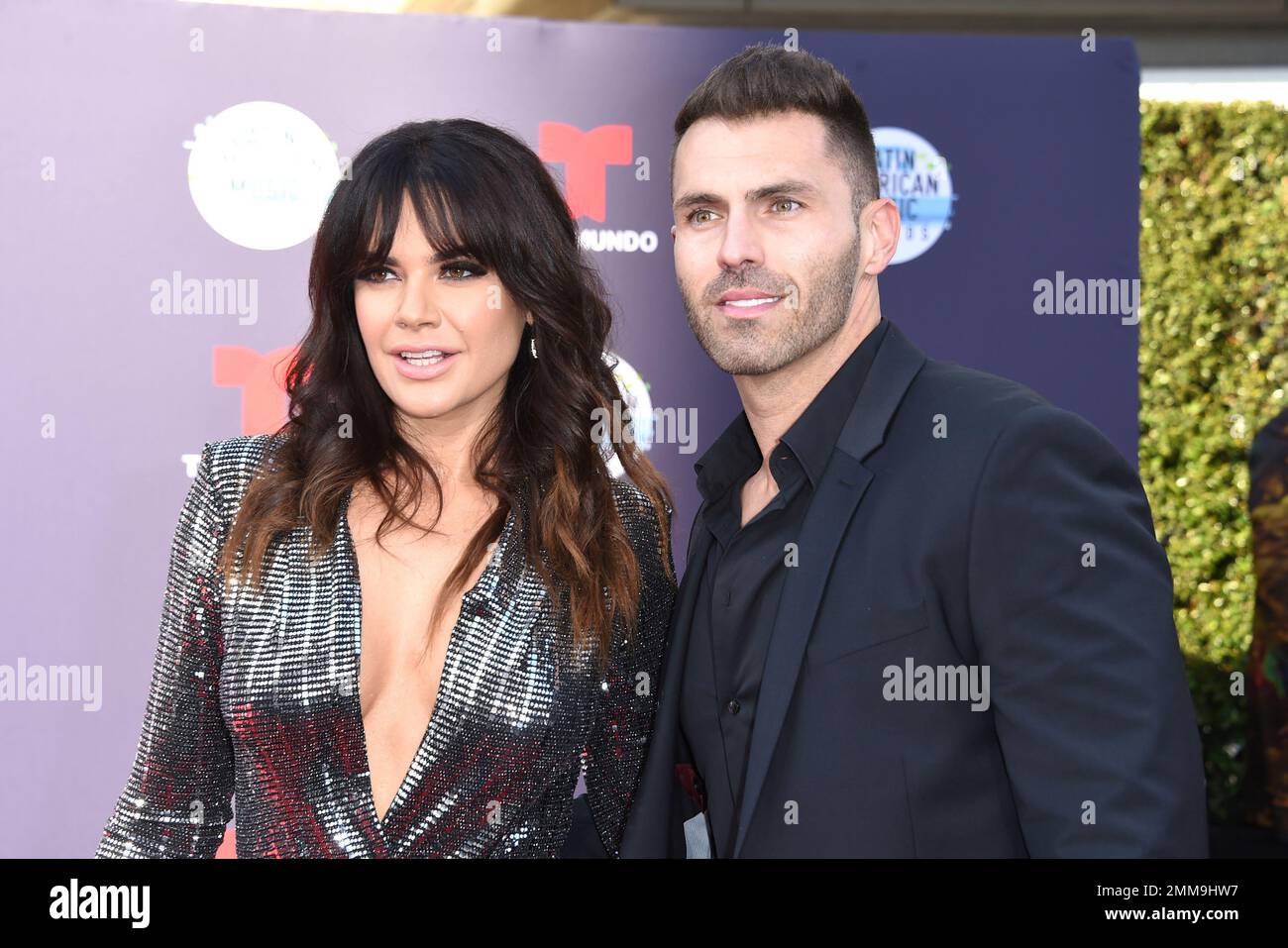 Angelica Celaya, left, and Luis Garcia arrive at the Latin American ...