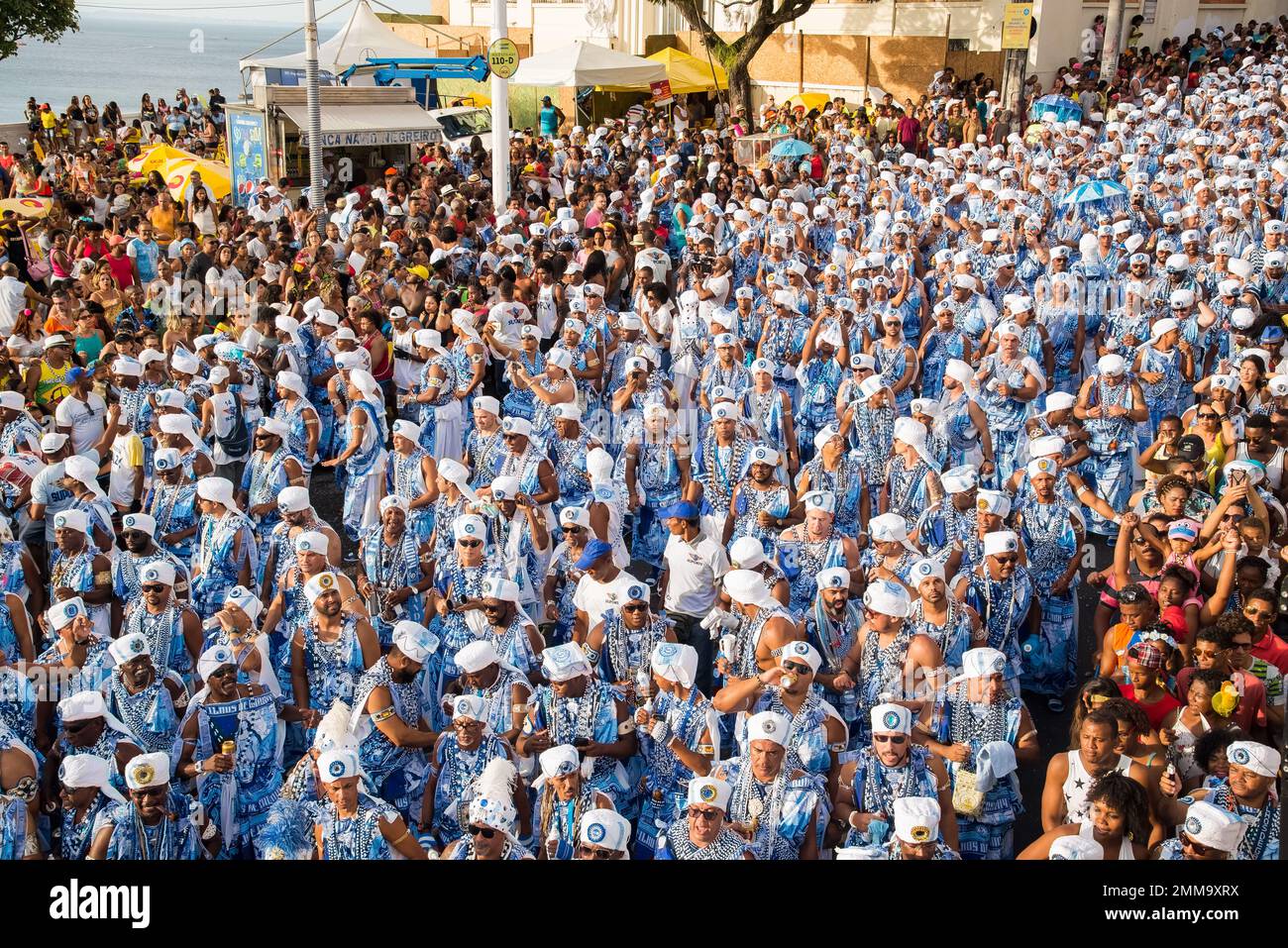 Salvador, Bahia, Brazil - February 11, 2018: Members of the traditional carnival block Filhos de Gandy parade in the streets of Salvador, Bahia during Stock Photo