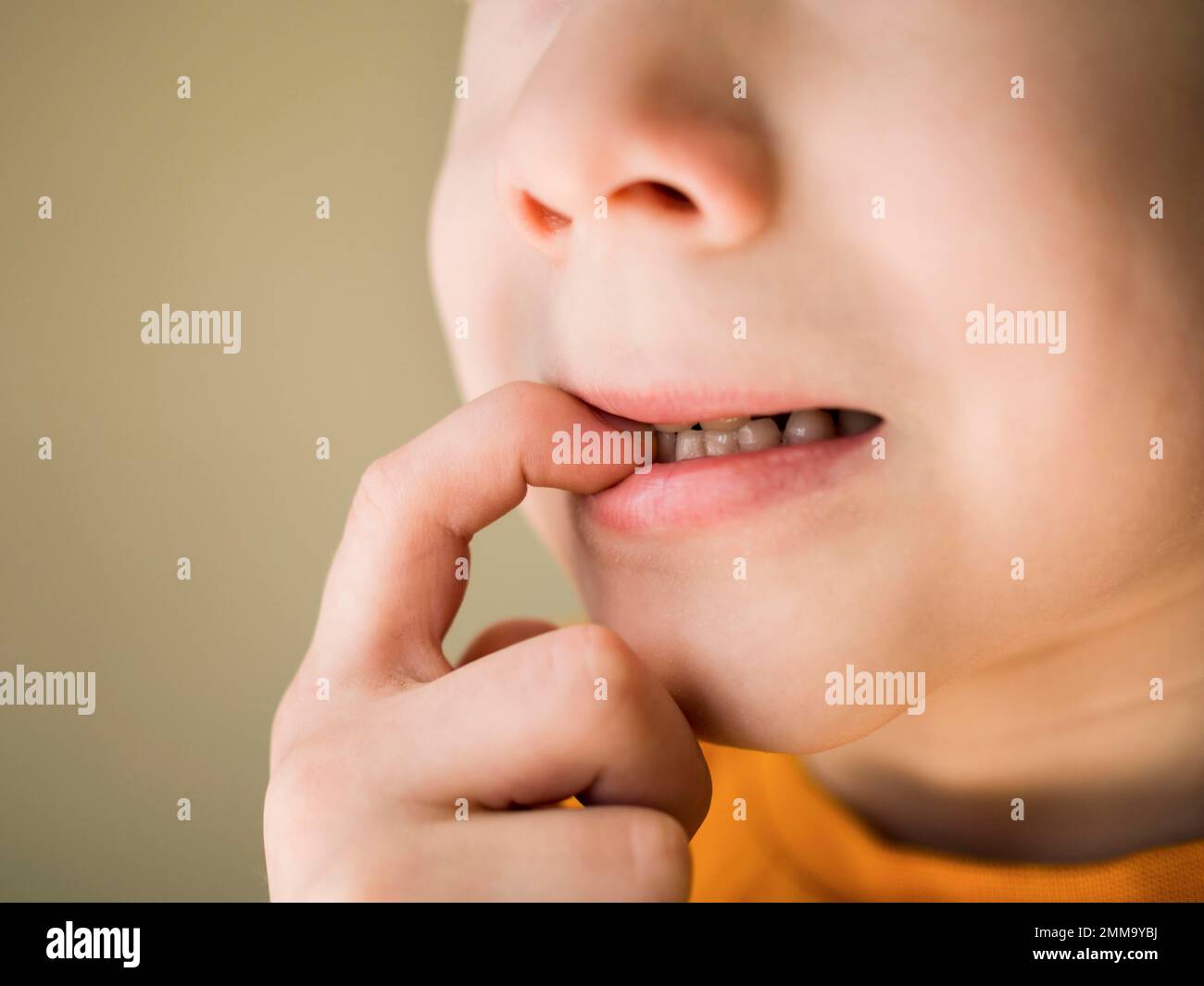 front view nail biting bad habit concept. High resolution photo Stock Photo