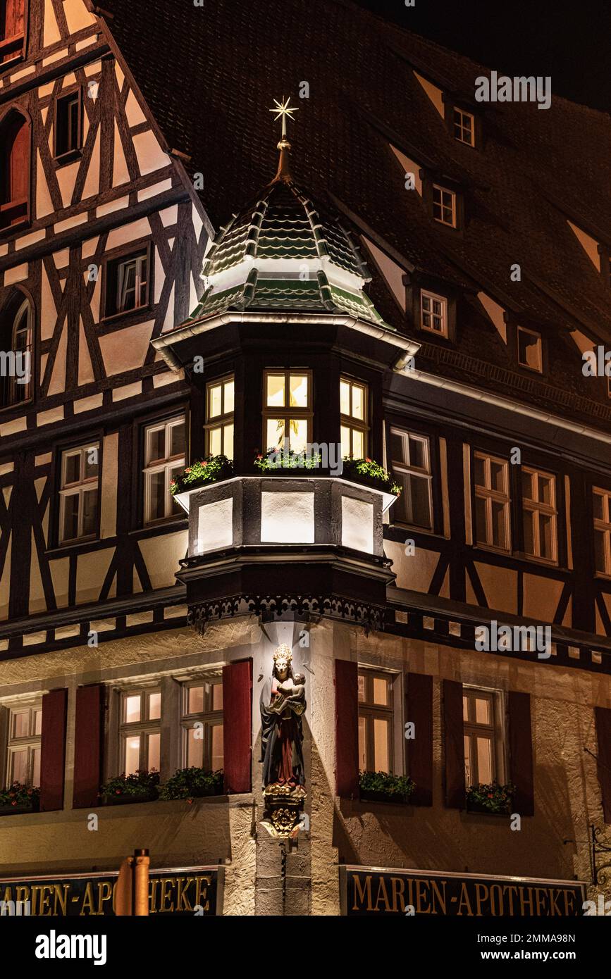 Oriel, Mary's figure, Mary's pharmacy, half-timbering, Rothenburg ob der Tauber, medieval small town, Franconia, night photograph Stock Photo