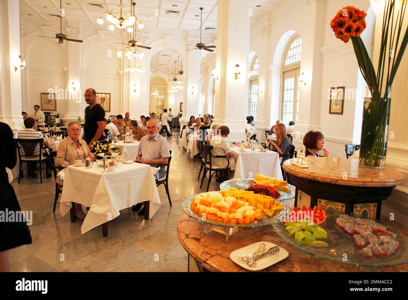 People at High Tea in the Grand Lobby, Raffles Hotel, Singapore Stock
