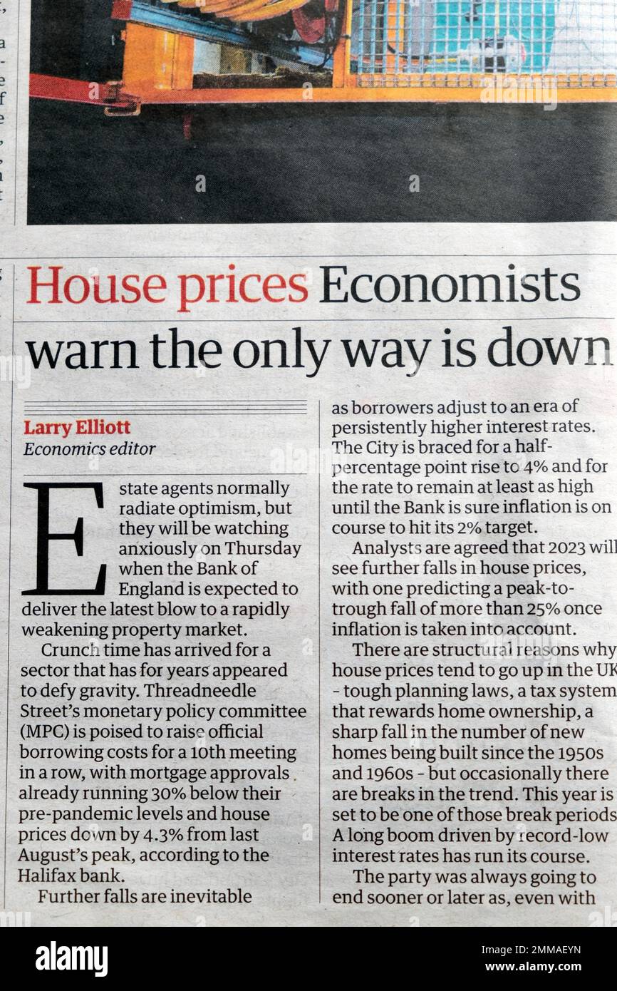 'House prices Economists warn the only way is down' Guardian newspaper headline housing market article clipping cutting 27 January 2023 City London UK Stock Photo