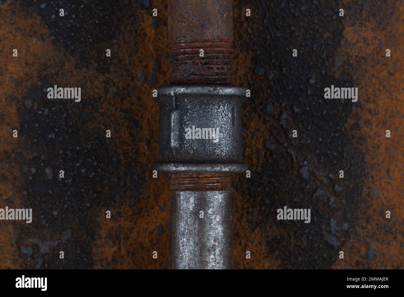 Old rusty valve pipes on rusty metal wall background Stock Photo - Alamy