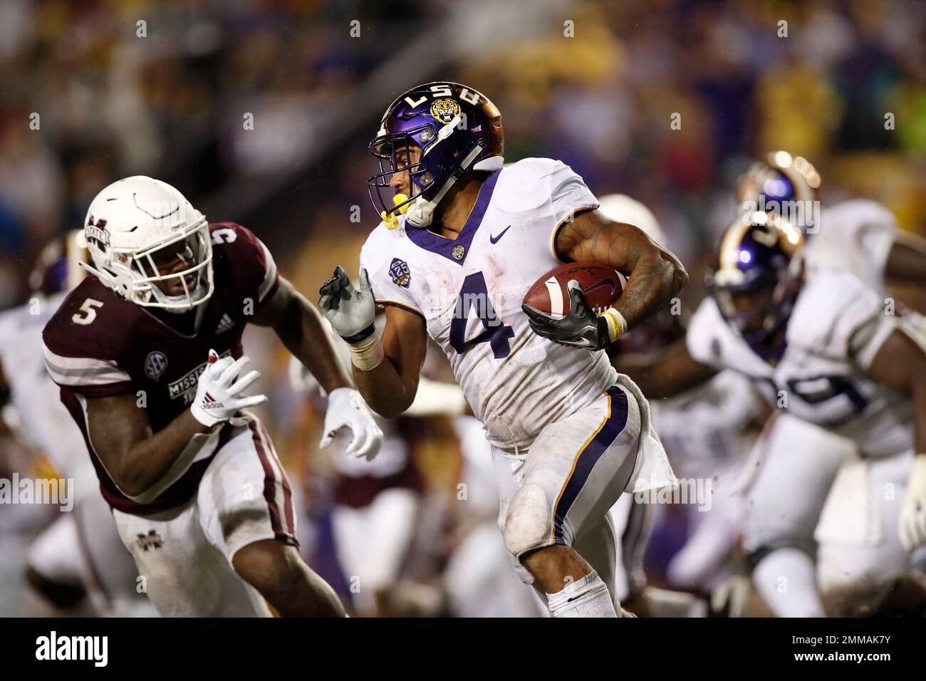 LSU running back Nick Brossette (4) runs past Mississippi State