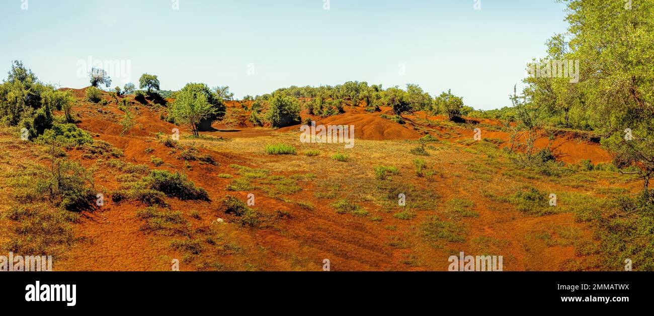 This is Kokkinopolis, red clay by its name between the green forests Stock Photo