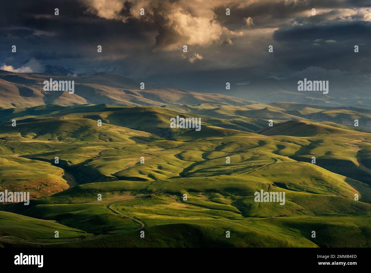 Sunset on hills in Caucasus mountains Stock Photo
