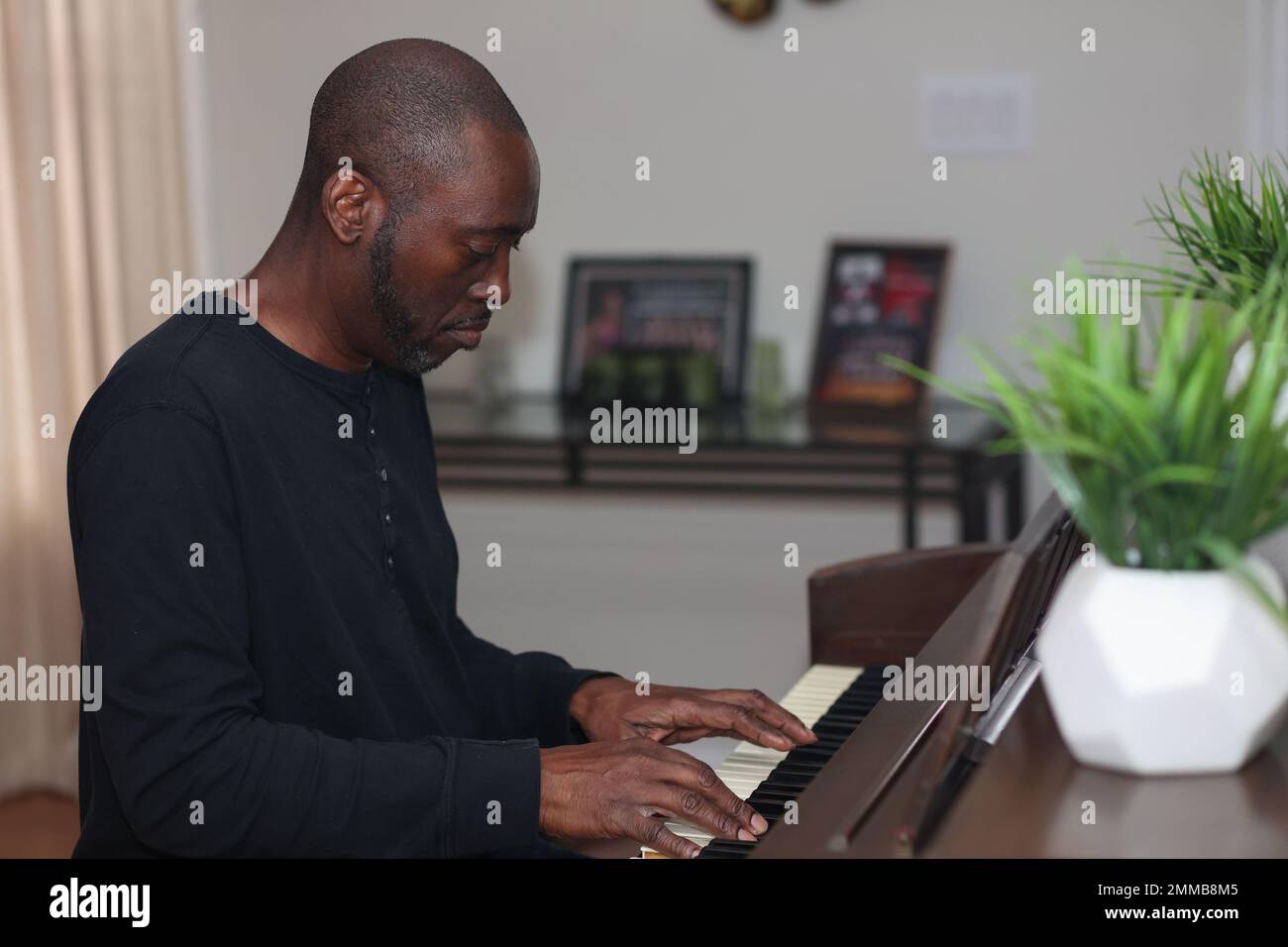 Black man playing hi-res stock photography and images - Alamy