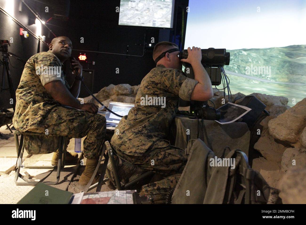 Air Naval Gunfire Liaison Company (ANGLICO) Marine Forces Reservists practice firing exercises in the Simulation Center prior to field exercises. Stock Photo