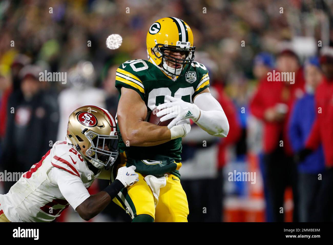 San Francisco 49ers cornerback Jimmie Ward (20) tackles Green Bay Packers tight end Jimmy Graham