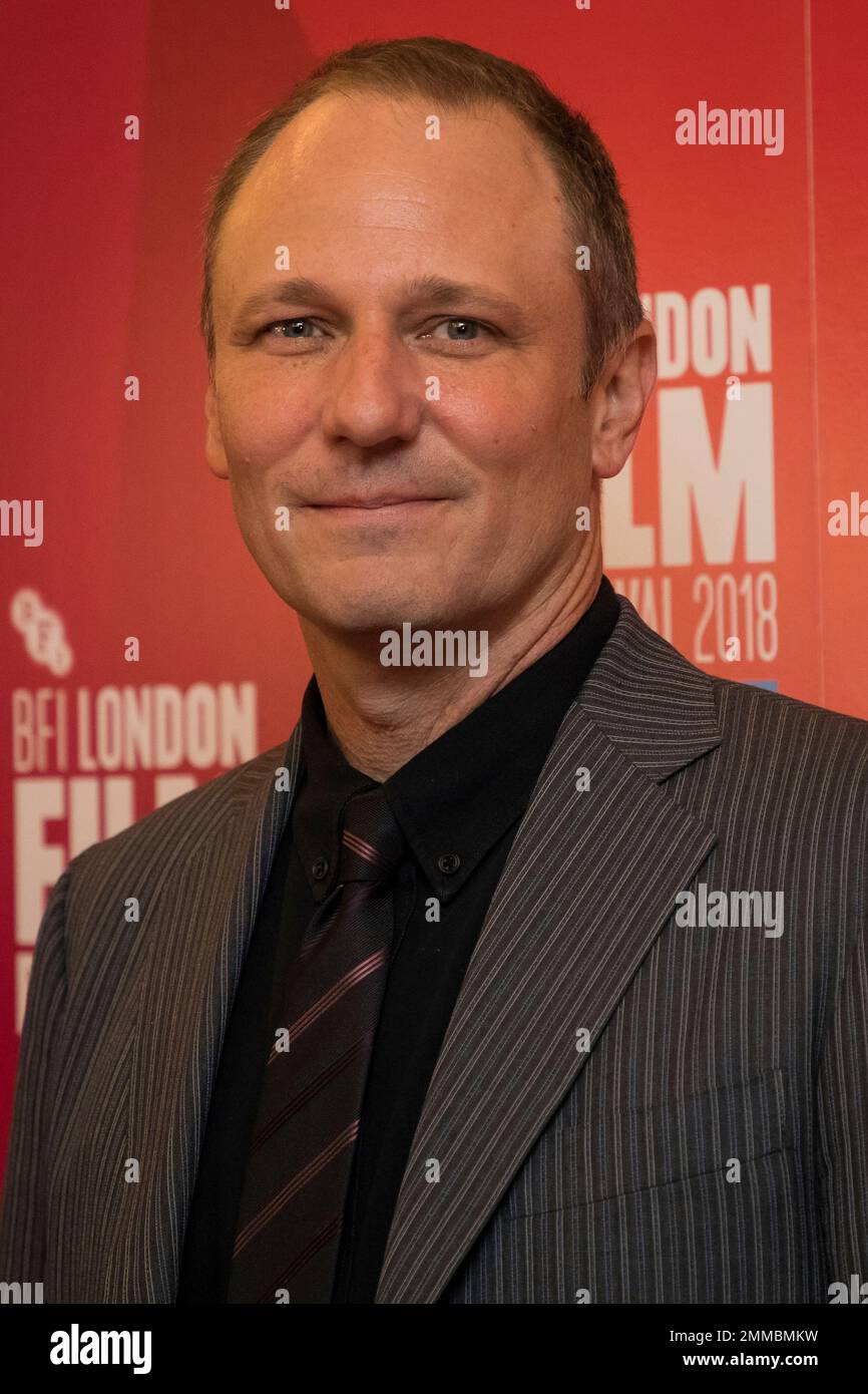 Producer and screenwriter Phil Hay poses for photographers upon arrival