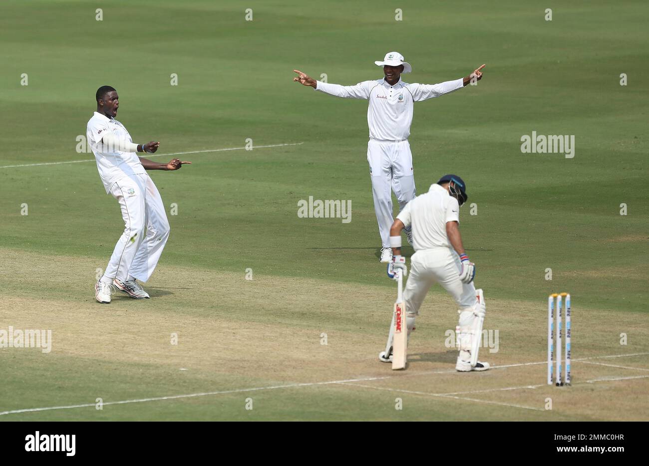 West Indies' cricketer Jason Holder celebrates the dismissal of India's Virat Kohli during the