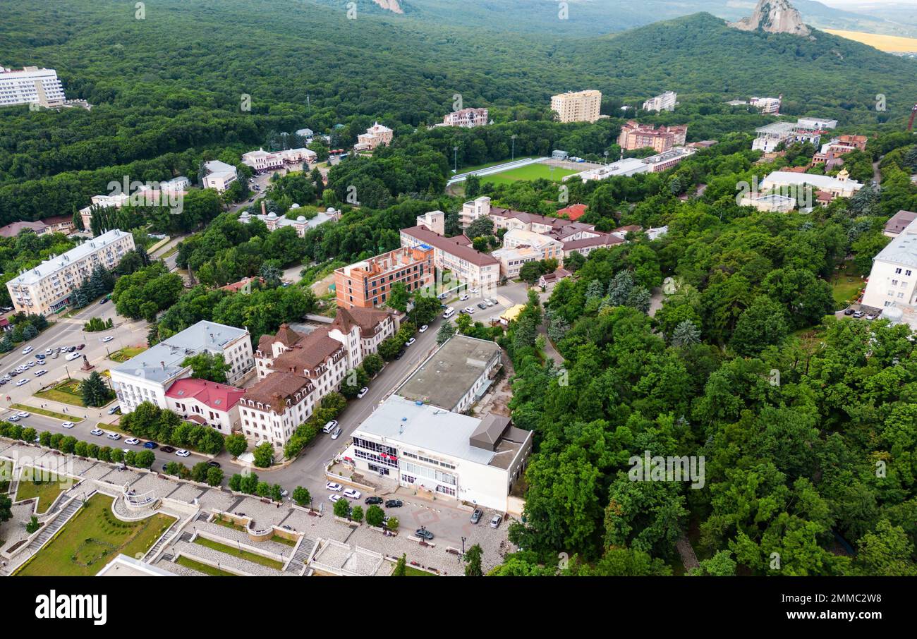 Aerial view of Zheleznovodsk city, Stavropol Krai, Russia. Landscape with buildings and green forest in Zheleznovodsk resort town in summer. Theme of Stock Photo