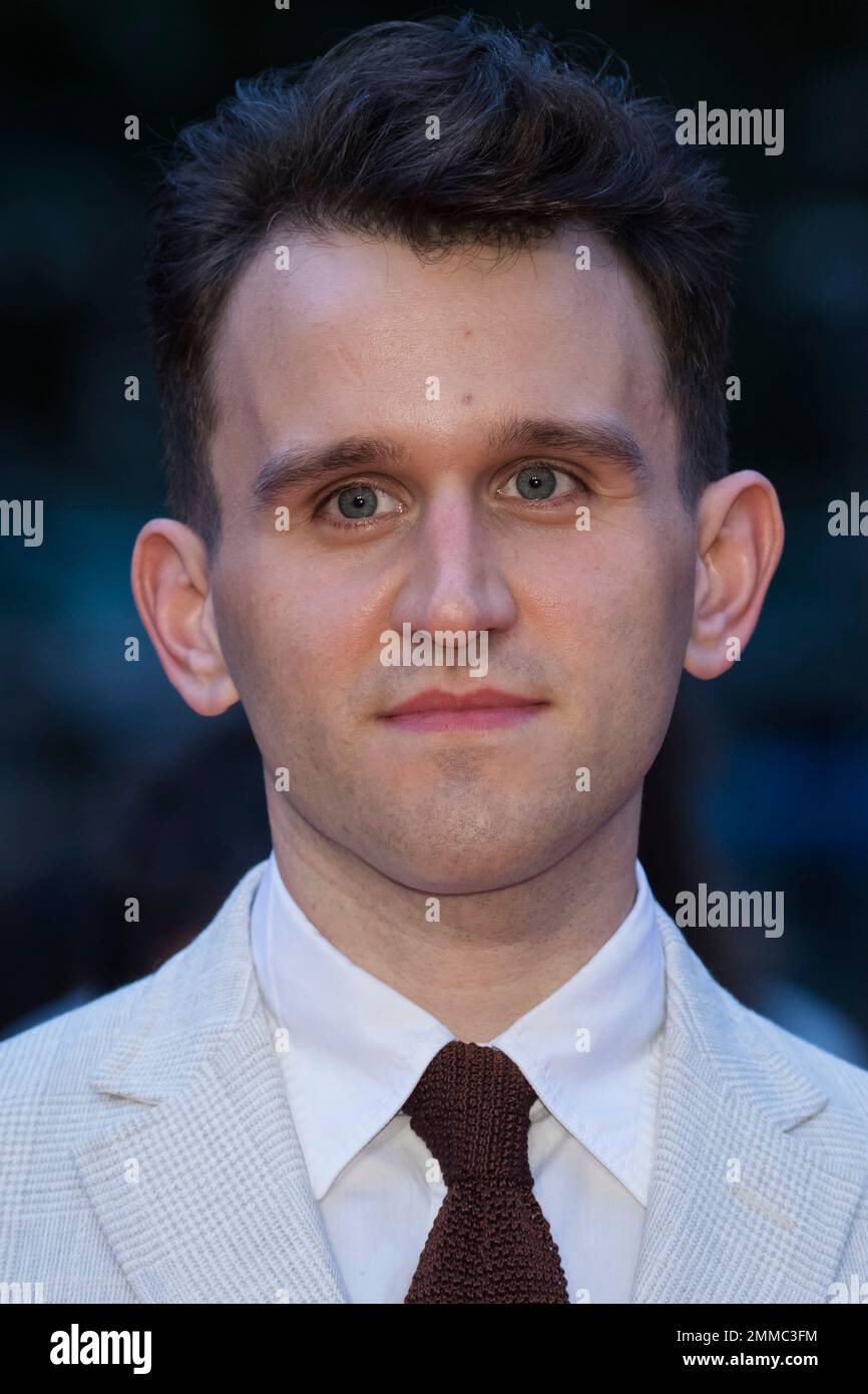 Actor Harry Melling poses for photographers upon arrival at the