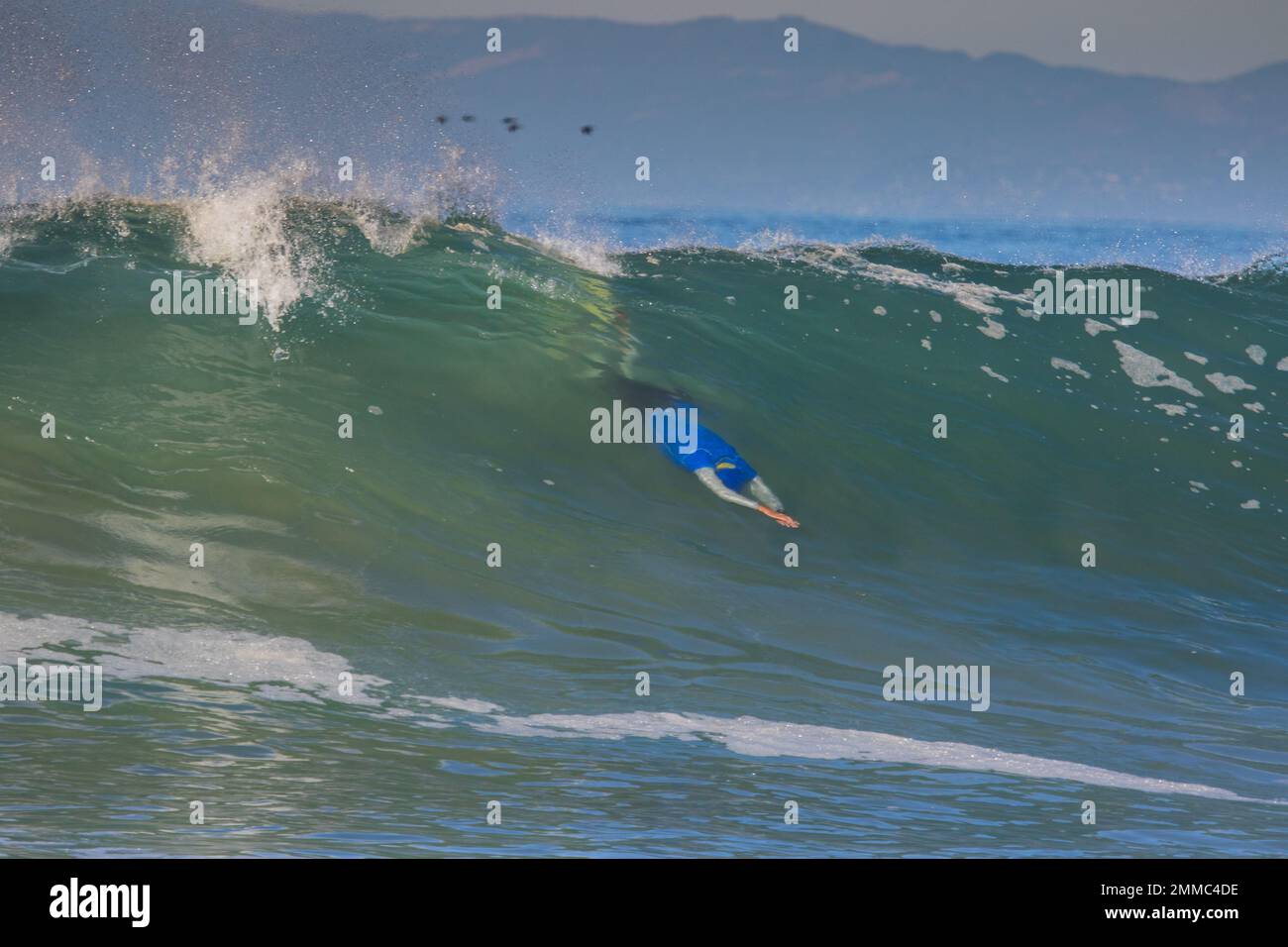 Bodysurfing waves at the South Jetty body surfing competition 2022 in Ventura, California , USA Stock Photo