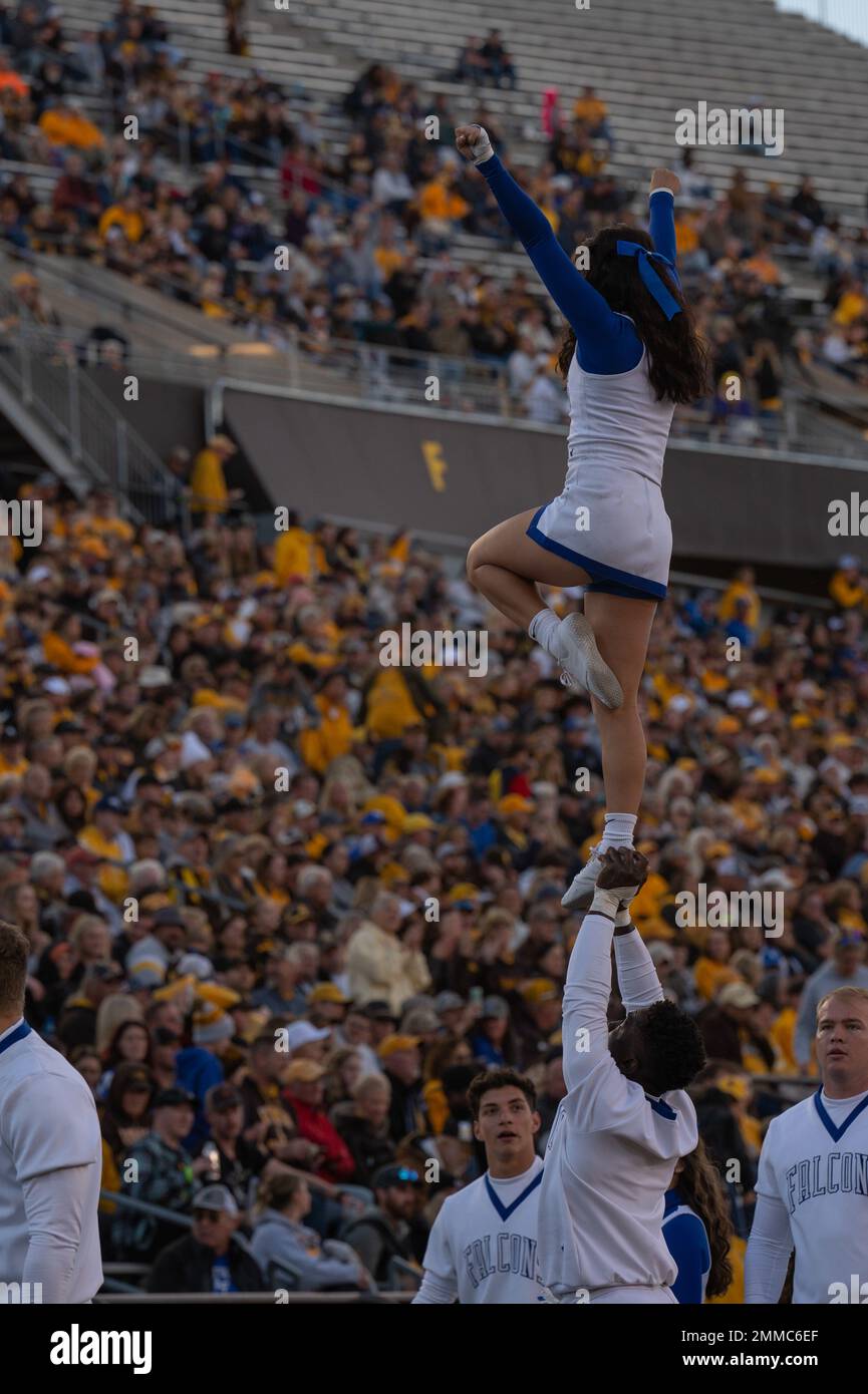 The Air Force Academy cheer team performs stunts during a football game ...