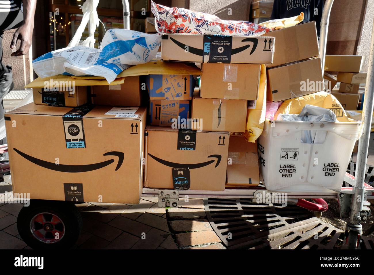 Amazon Prime boxes are loaded on a cart for delivery, Oct. 10, 2018 in ...