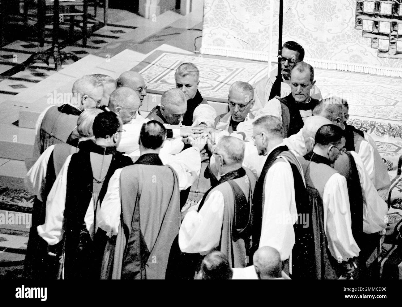 The Very Rev. Paul Moore Jr. is pictured at center with back to camera