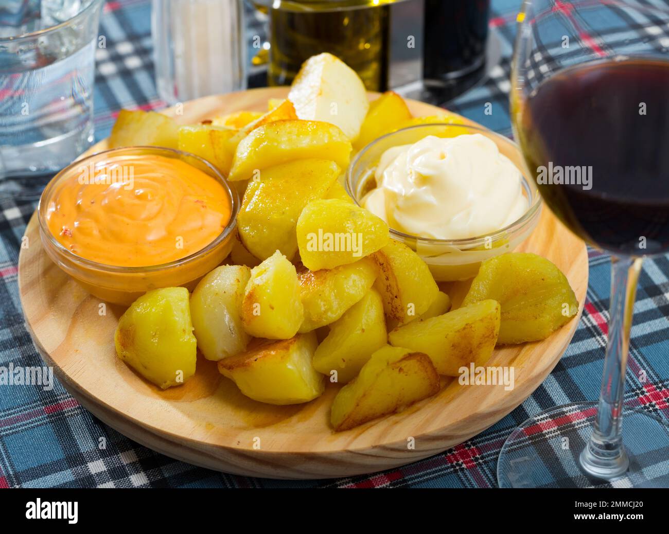 Patatas bravas with garlic mayonnaise and sauce Stock Photo Alamy