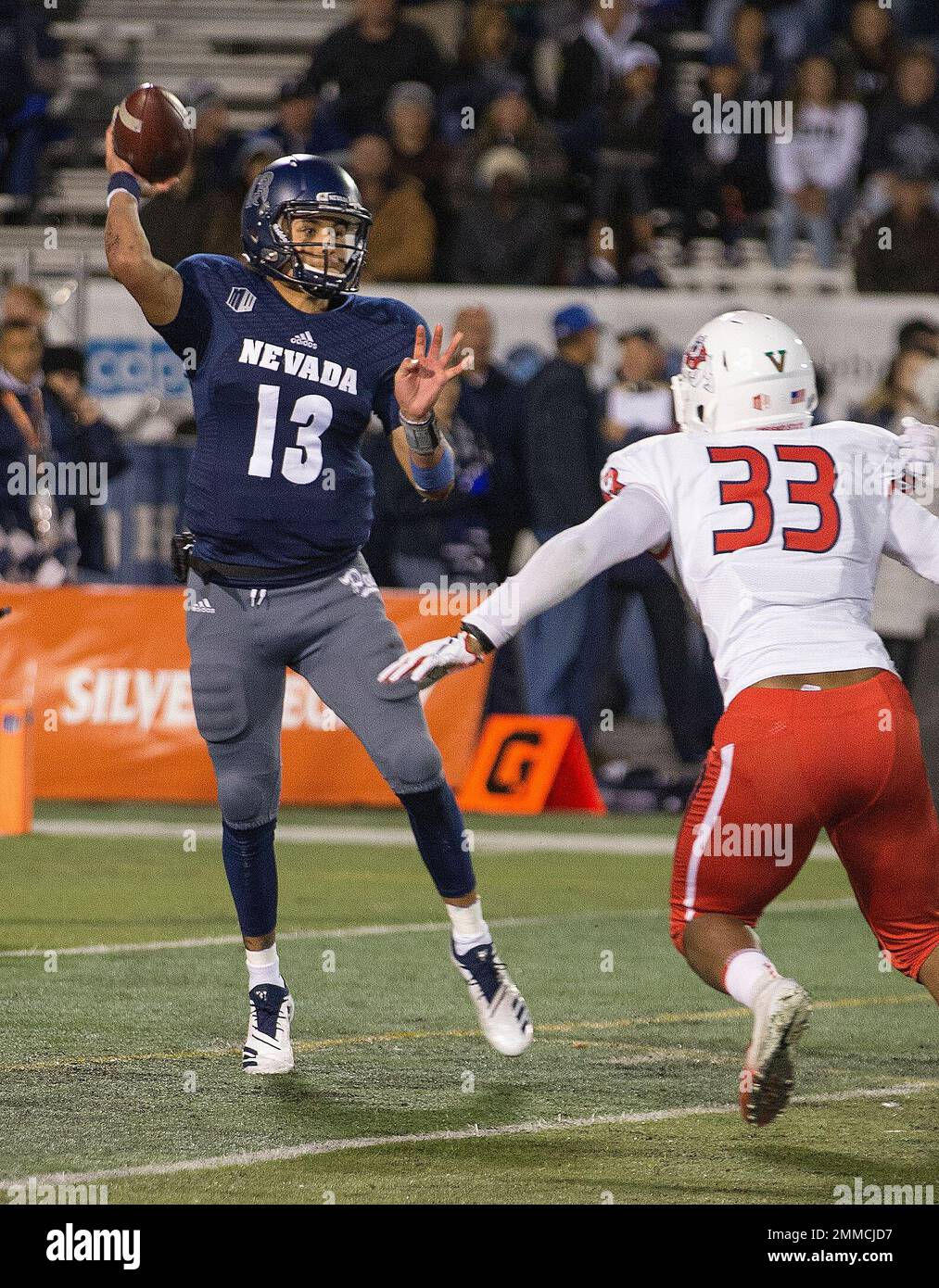 Nevada quarterback Cristian Solano (13) throws on the run against Fresno  State in the first half