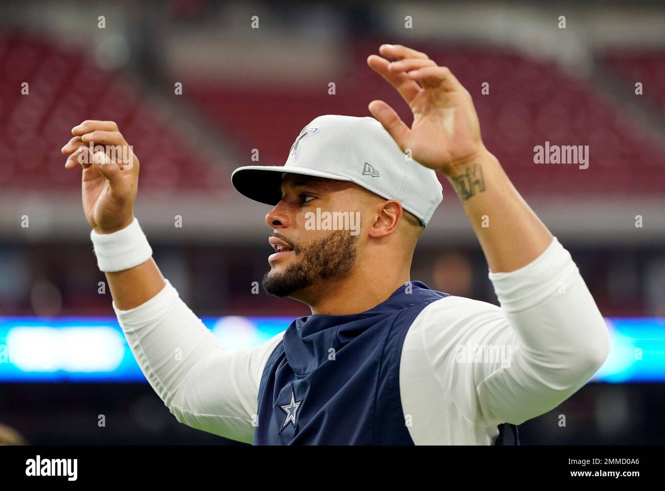 Dallas Cowboys quarterback Dak Prescott wears a Crucial Catch hat as he  warms up for an NFL football game against the Houston Texans, Sunday, Oct.  7, 2018, in Houston. (AP Photo/David J.
