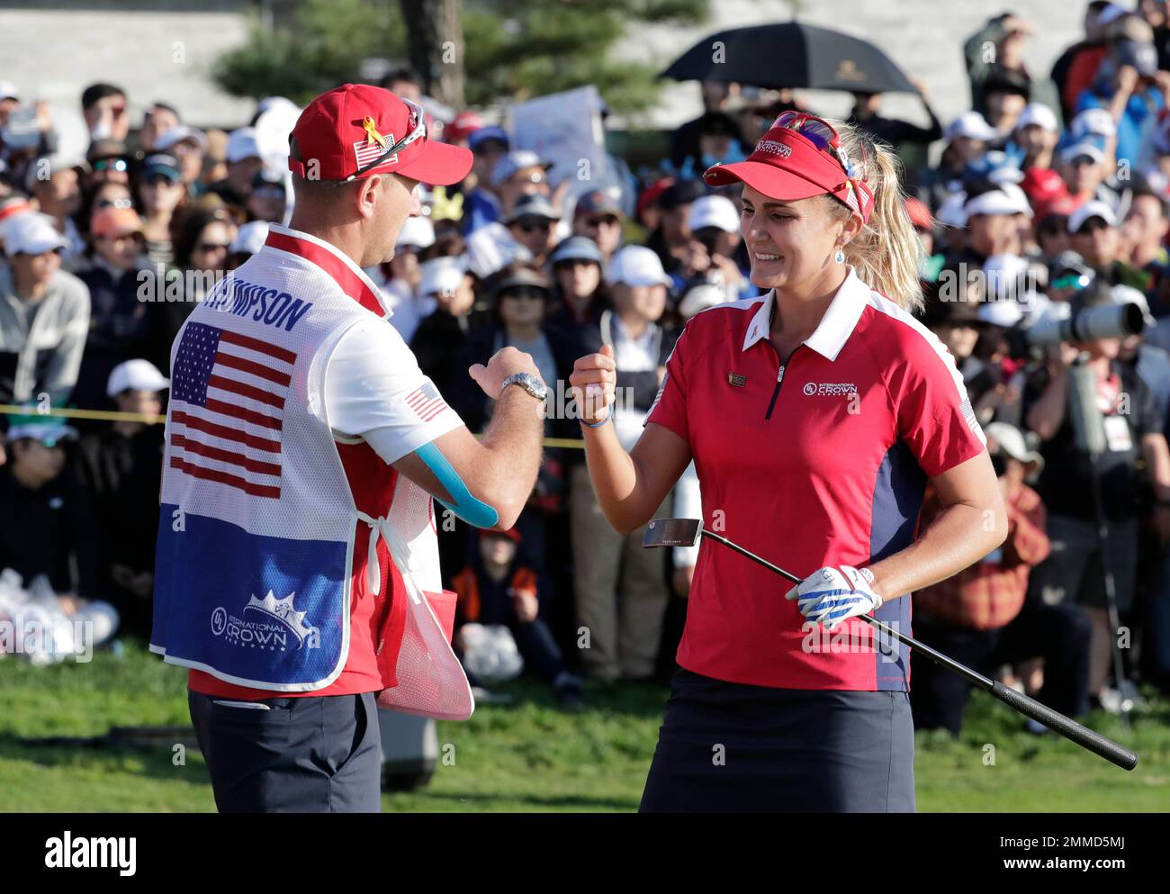 Lexi Thompson of the United States, right, reacts with her caddie on the 18th hole after