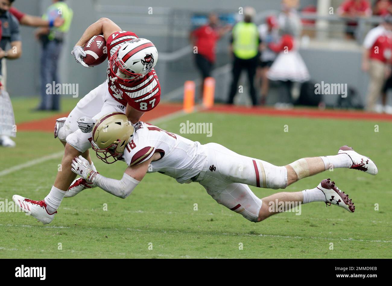 North Carolina State's Thayer Thomas (87) is tackled by Boston College's  Mike Palmer during the second half an NCAA college football game in  Raleigh, N.C., Saturday, Oct. 6, 2018. North Carolina State