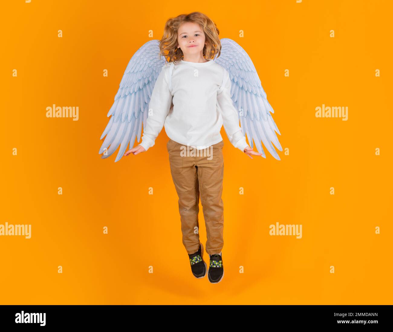 Little angel jump, kids jumping, full body. Cute angel kid, studio