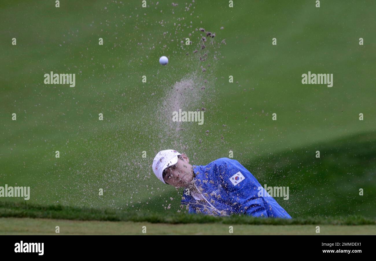 Sung Hyun Park of South Korea hits out of a bunker on the first hole during the second round of