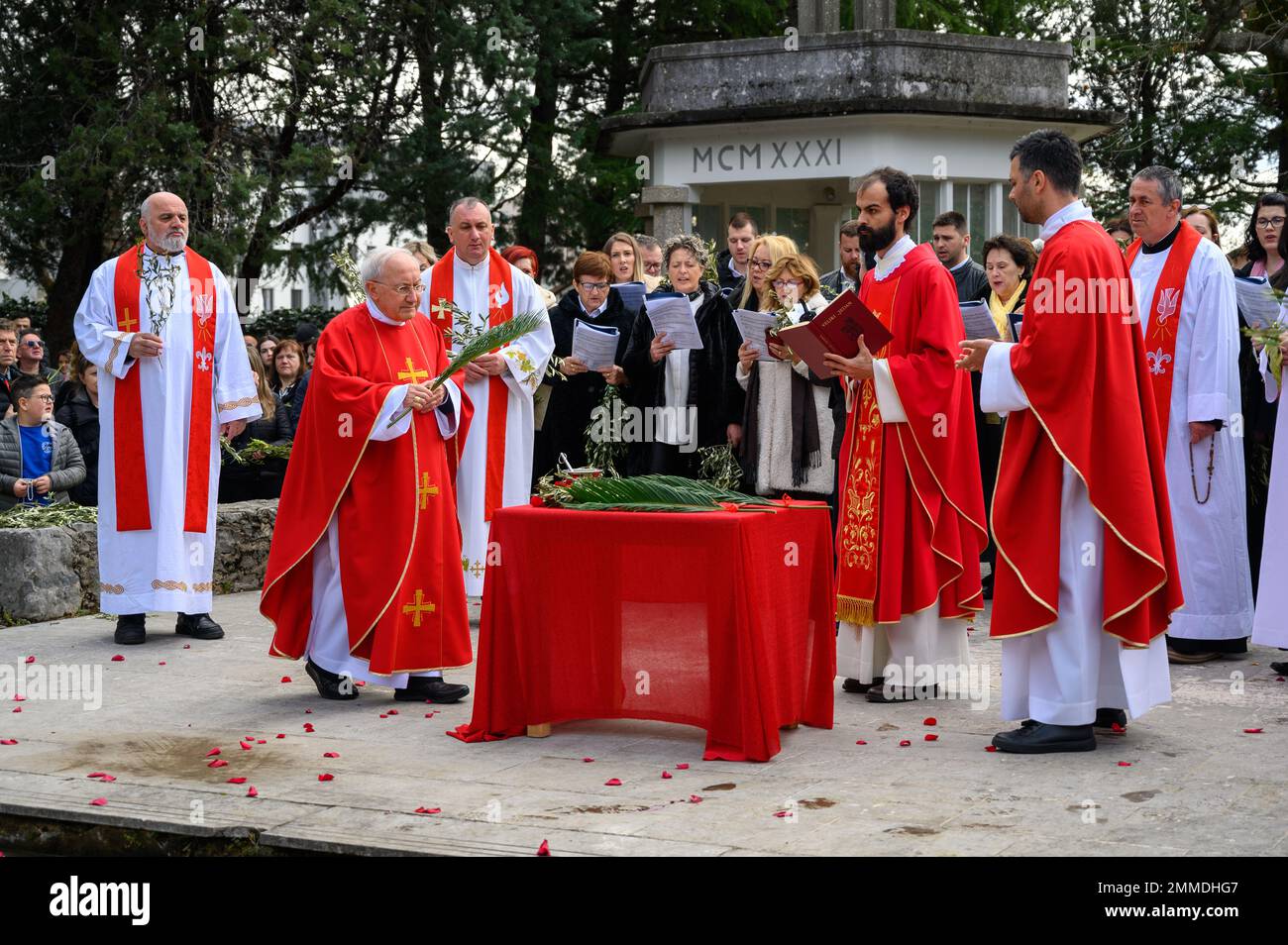 Blessing of the palms on Palm Sunday in Medjugorje, Bosnia and Herzegovina. Msgr. Aldo Cavalli, the Apostolic Visitor to Medjugorje, is also present. Stock Photo