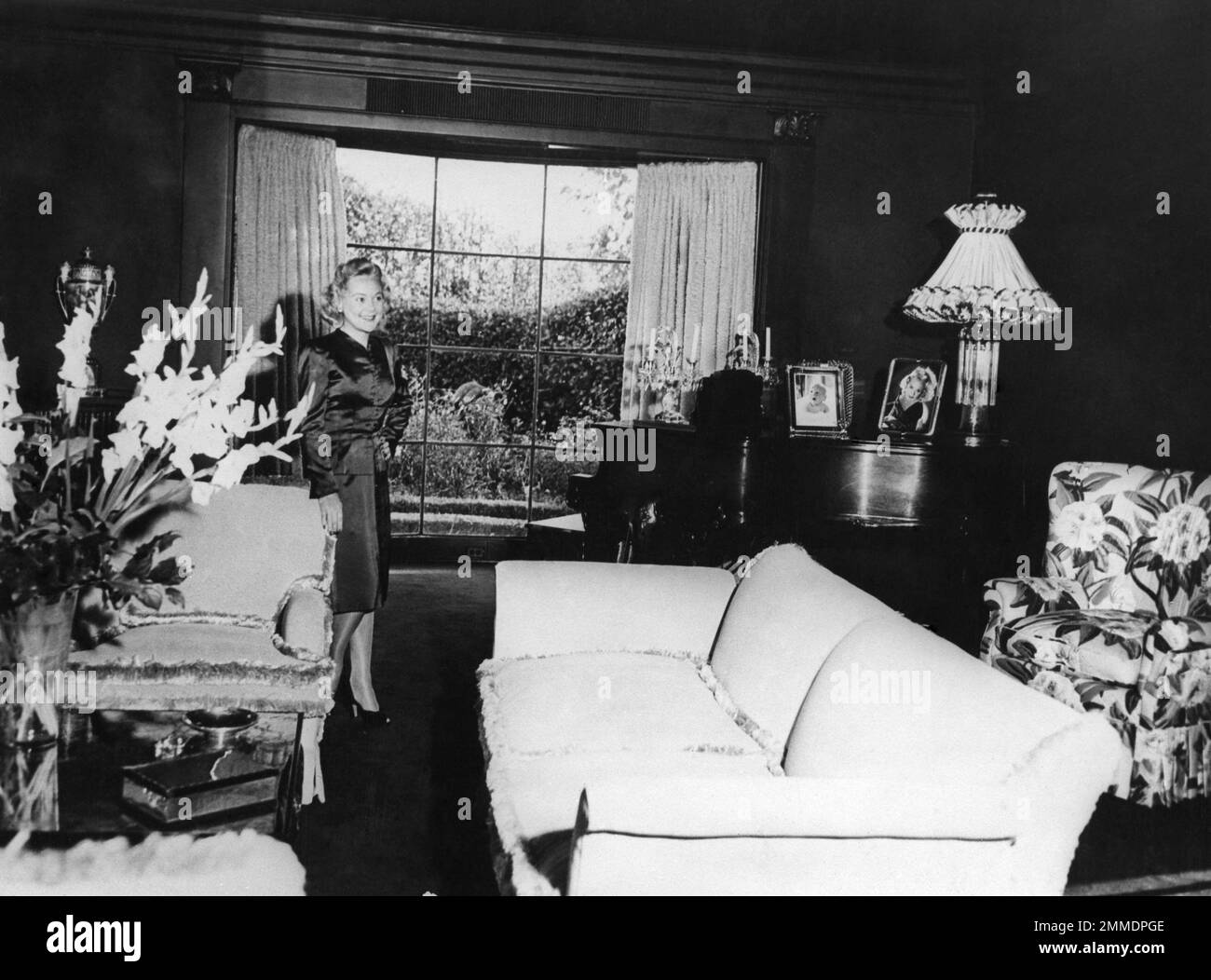Puce Ribbon In this photo Sonja Henie surveys with evident pleasure the drawing ...