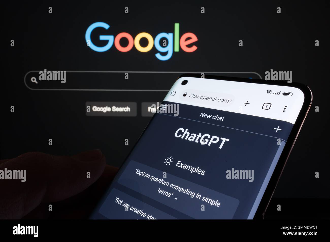 ChatGPT chat bot page seen on smartphone and laptop display with blurred GOOGLE search page. AI chatbot vs search engine. Concept. Stafford, United Ki Stock Photo