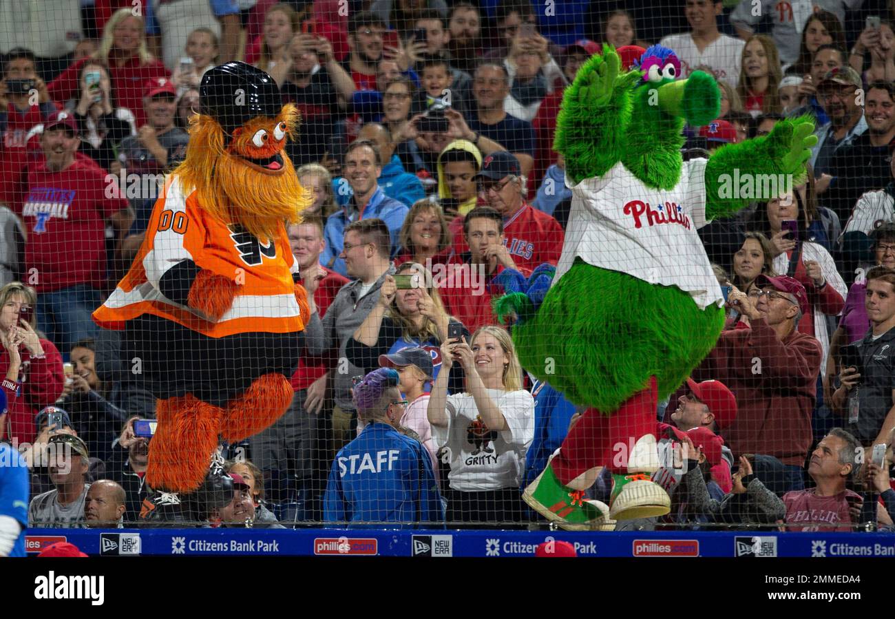 Gritty, the Philadelphia Flyers' mascot, left, and the Philly Phanatic  dance during a baseball game between the Philadelphia Phillies and the  Atlanta Braves, Saturday, Sept. 29, 2018, in Philadelphia. The Phillies won