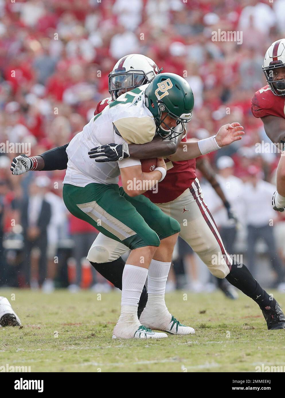 Baylor quarterback Charlie Brewer (12) is sacked by Oklahoma