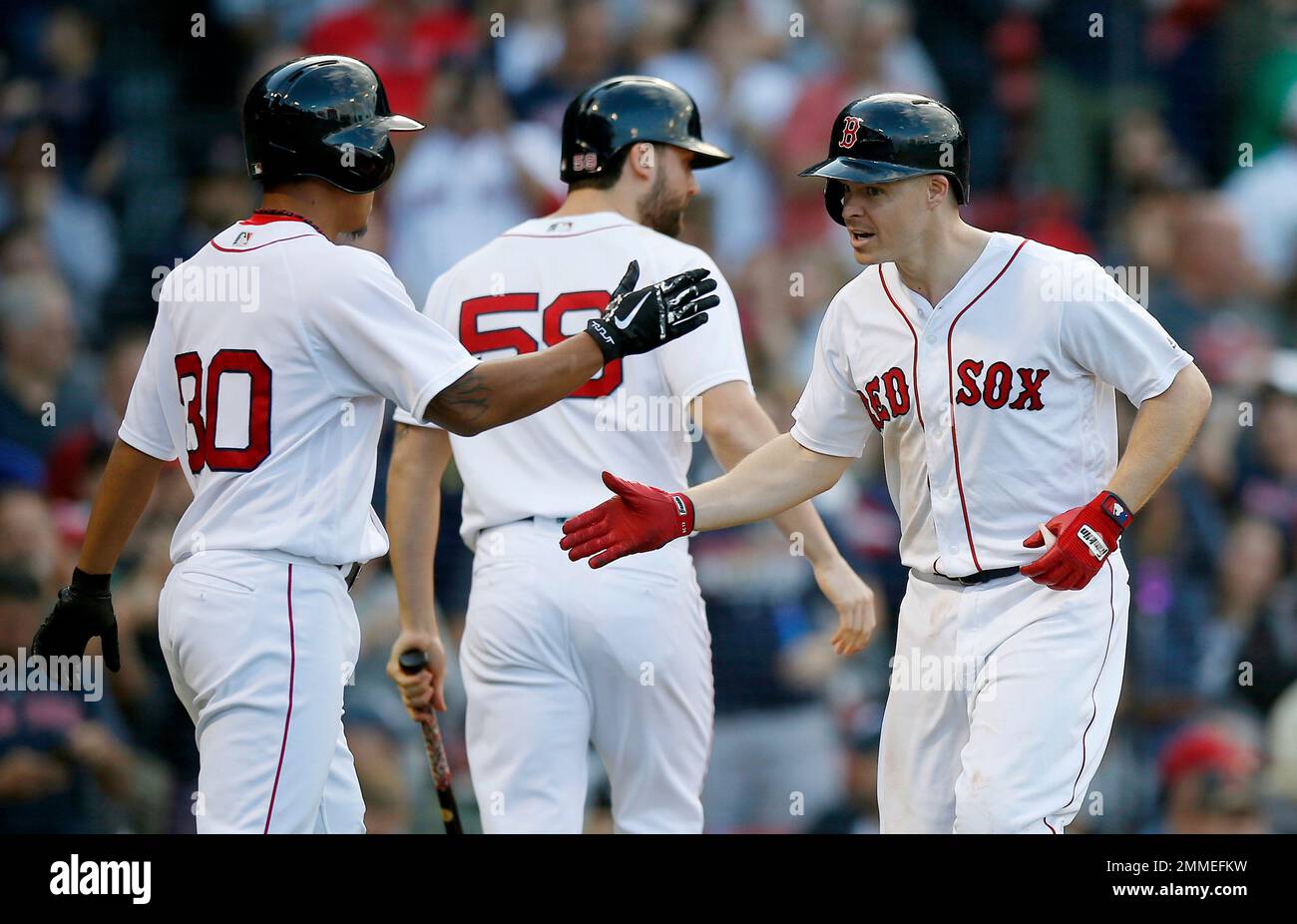 Boston Red Sox's Brock Holt, right, celebrates his two-run home