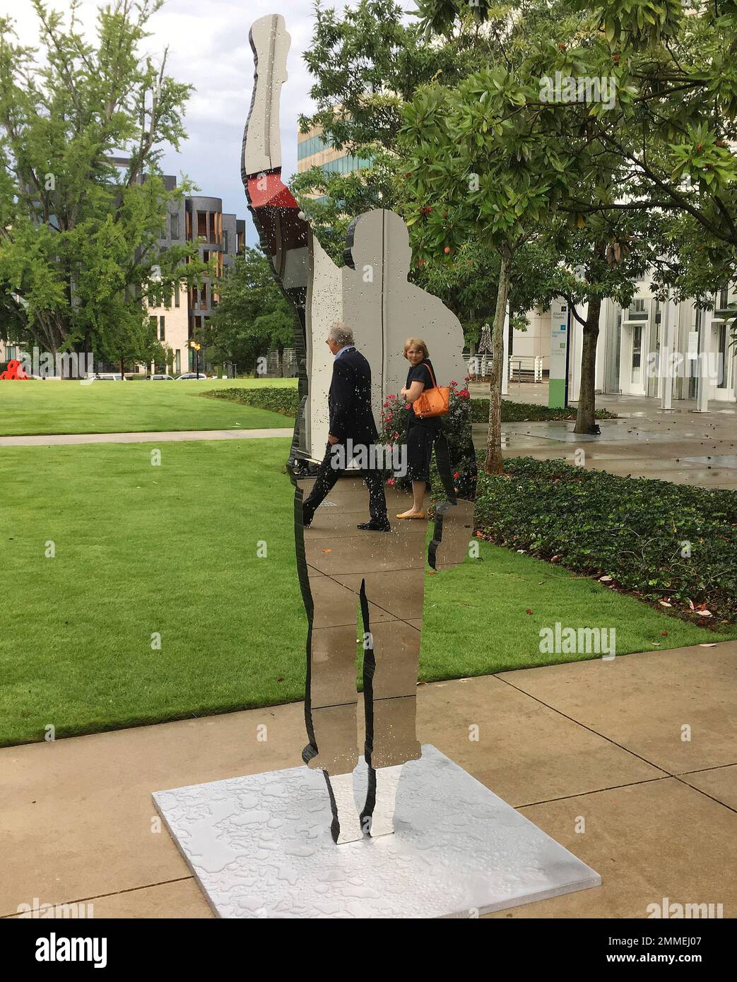 In this Sept. 26, 2018, photo, people can be seen reflected in the