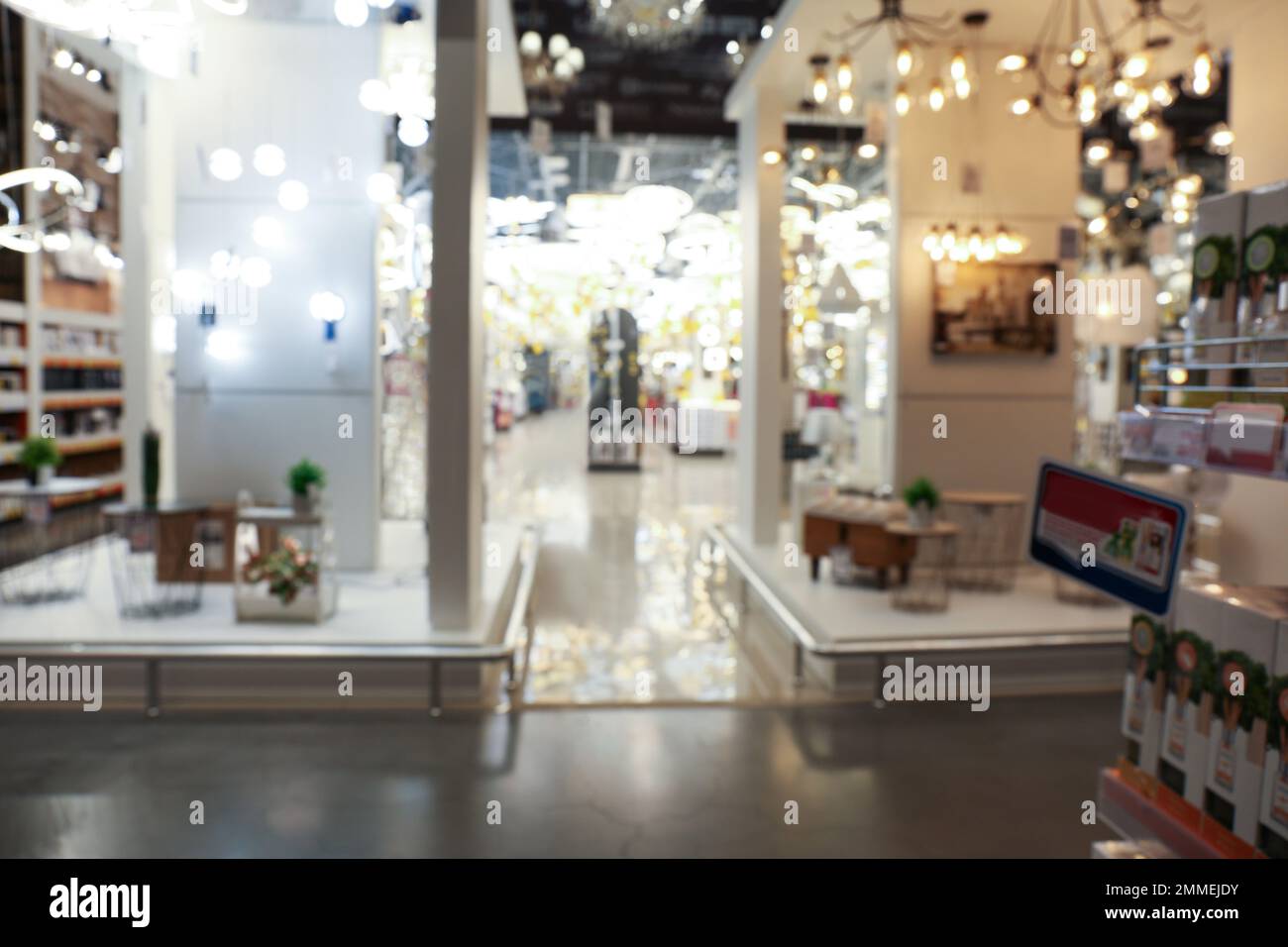 Blurred view of lighting store in shopping mall. Bokeh effect Stock Photo